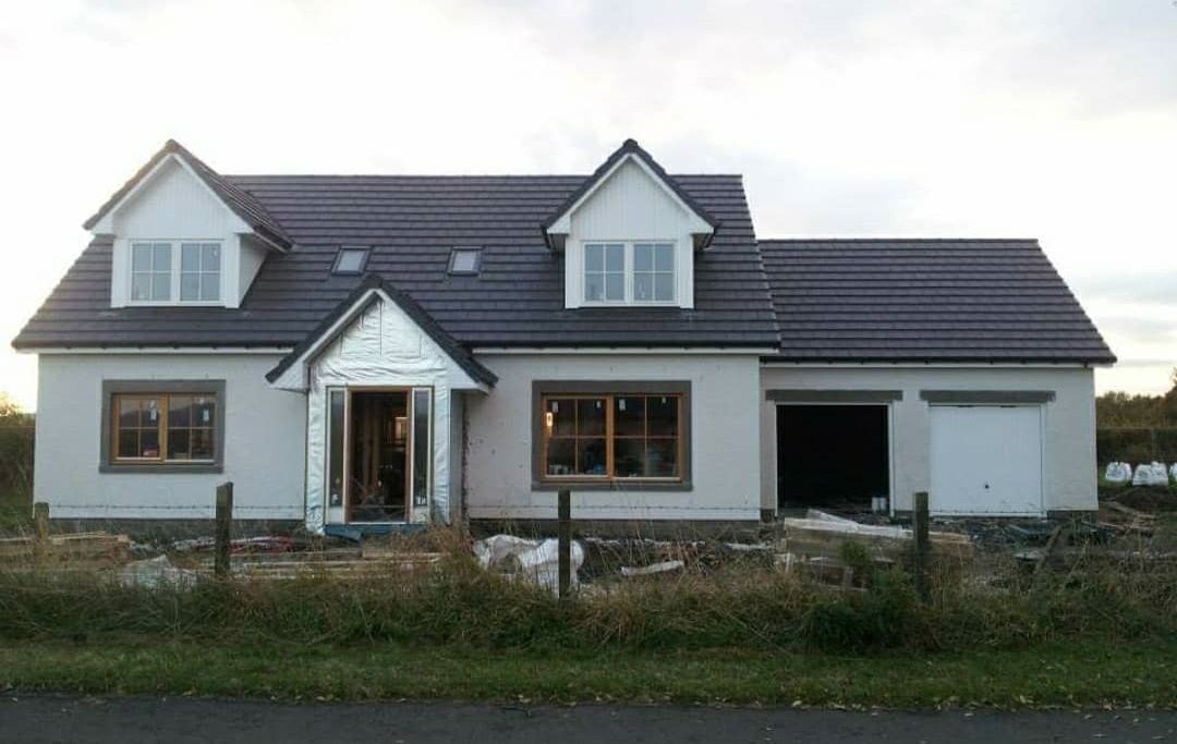 MF Roofing - House with new roofing, front view